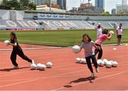 17 March 2018; Local children during a LGFA coaching session before the 2016 All-Stars v 2017 All-Stars Exhibition match on the TG4 Ladies Football All-Star Tour 2018. Chulalongkorn University Football Club Stadium, Bangkok, Thailand. Photo by Piaras Ó Mídheach/Sportsfile