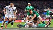 17 March 2018; Garry Ringrose of Ireland dives over to score his side's first try despite the tackle of Anthony Watson of England during the NatWest Six Nations Rugby Championship match between England and Ireland at Twickenham Stadium in London, England. Photo by Ramsey Cardy/Sportsfile