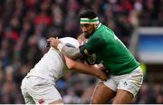 17 March 2018; Bundee Aki of Ireland is tackled by George Kruis of England during the NatWest Six Nations Rugby Championship match between England and Ireland at Twickenham Stadium in London, England. Photo by Ramsey Cardy/Sportsfile