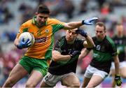 17 March 2018: Martin Farragher of Corofin in action against Alan Cronin of Nemo Rangers during the AIB GAA Football All-Ireland Senior Club Championship Final match between Corofin and Nemo Rangers at Croke Park in Dublin. Photo by David Fitzgerald/Sportsfile