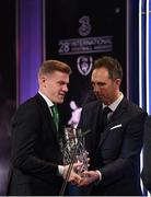 18 March 2018; Karl Donnelly, Head of Sponsorship at 3 Ireland, presents James McClean with the 'Three' International Goal of the Year during the 3 FAI International Awards at RTE Studios in Donnybrook, Dublin. Photo by Stephen McCarthy/Sportsfile