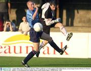 7 August 2003; St Patrick's Athletic goalkeeper Chris Adamson in action against Mark Rooney of UCD during Eircom League Premier Division match betweem St Patrick's Athletic and UCD at Richmond Park in Dublin. Photo by Damien Eagers/Sportsfile