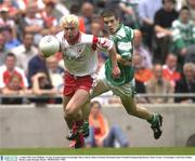 3 August 2003; Owen Mulligan of Tyrone, in action against Barry Owens of Fermanagh during the Bank of Ireland All-Ireland Senior Football Championship Quarter Final match between Tyrone and Fermanagh at Croke Park in Dublin. Photo by Brendan Moran/Sportsfile