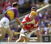 10 August 2003; Joe Deane of Cork, in action against Darragh Ryan, left, and Darren Stamp of Wexford during the Guinness All-Ireland Senior Hurling Championship Semi-Final match between Cork and Wexford at Croke Park in Dublin. Photo by Ray McManus/Sportsfile