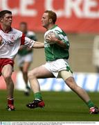 3 August 2003; Shaun Doherty of Fermanagh, in action against Tyrone Enda McGinley of Tyrone during the Bank of Ireland All-Ireland Senior Football Championship Quarter Final match between Tyrone and Fermanagh at Croke Park in Dublin. Photo by Brendan Moran/Sportsfile