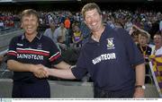 10 August 2003; Cork manager Donal O'Grady shakes hands with Wexford manager John Conran after the Guinness All-Ireland Senior Hurling Championship Semi-Final match between the Cork and Wexford at Croke Park in Dublin. Photo by Damien Eagers/Sportsfile