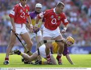 10 August 2003; Diarmuid O'Sullivan of Cork, in action against Michael Jordan of Wexford during the Guinness All-Ireland Senior Hurling Championship Semi-Final match between Cork and Wexford at Croke Park in Dublin. Photo by Ray McManus/Sportsfile