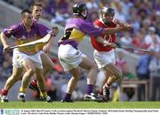 10 August 2003; Ben O'Connor of Cork, in action against Darren Stamp of Wexford during the Guinness All-Ireland Senior Hurling Championship Semi-Final match between Cork and Wexford at Croke Park in Dublin. Photo by Damien Eagers/Sportsfile