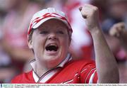 10 August 2003; A Cork supporter cheers on her teamduring the Guinness All-Ireland Senior Hurling Championship Semi-Final match between Cork and Wexford at Croke Park in Dublin. Photo by Damien Eagers/Sportsfile