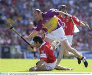10 August 2003; Sean Og O'hAilpin of Cork, with a Paddy Power sponsored hurley, in action against Larry Murphy of Wexfordduring the Guinness All-Ireland Senior Hurling Championship Semi-Final match between Cork and Wexford at Croke Park in Dublin. Photo by Ray McManus/Sportsfile