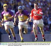 10 August 2003; Michael O'Connell of Cork, in action against Liam Dunne, centre, and Rory McCarthy of Wexford during the Guinness All-Ireland Senior Hurling Championship Semi-Final match between Cork and Wexford at Croke Park in Dublin.   Photo by Damien Eagers/Sportsfile