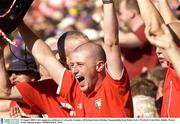 10 August 2003; Cork supporters, celebrate a score for they team during the Guinness All-Ireland Senior Hurling Championship Semi-Final match between Cork and Wexford at Croke Park in Dublin. Photo by Damien Eagers/Sportsfile