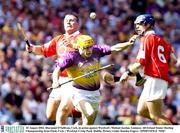 10 August 2003; Diarmuid O'Sullivan of Cork, in action against Michael Jordan of Wexford during the Guinness All-Ireland Senior Hurling Championship Semi-Final match between Cork and Wexford at Croke Park in Dublin. Photo by Damien Eagers/Sportsfile