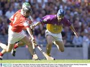 10 August 2003; Liam Dunne of Wexford, in action against Ben O'Connor of Cork during the Guinness All-Ireland Senior Hurling Championship Semi-Final match between Cork and Wexford at Croke Park in Dublin. Photo by Damien Eagers/Sportsfile