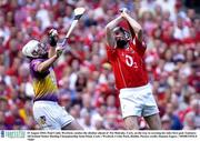 10 August 2003; Paul Codd of Wexford, catches the sliothar ahead of Pat Mulcahy of Cork, on the way to scoring his sides first goal during the Guinness All-Ireland Senior Hurling Championship Semi-Final match between Cork and Wexford at Croke Park in Dublin. Photo by Damien Eagers/Sportsfile