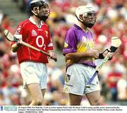 10 August 2003; Pat Mulcahy of Cork, left, and Paul Codd of Wexford, who is using a paddy power sponsored hurley during the Guinness All-Ireland Senior Hurling Championship Semi-Final match between Cork and Wexford at Croke Park in Dublin. Photo by Damien Eagers/Sportsfile