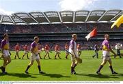 10 August 2003; Wexford captain Paul Codd leads his players during the pre-match parade before Guinness All-Ireland Senior Hurling Championship Semi-Final match between Cork and Wexford at Croke Park in Dublin. Photo by Damien Eagers/Sportsfile