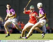 10 August 2003; Niall McCarthy of Cork, in action against Declan Ruth and Liam Dunne of Wexford during the Guinness All-Ireland Senior Hurling Championship Semi-Final match between Cork and Wexford at Croke Park in Dublin. Photo by Damien Eagers/Sportsfile