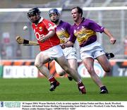 10 August 2003; Wayne Sherlock of Cork, in action against Adrian Fenlon and Rory Jacob of Wexford during the Guinness All-Ireland Senior Hurling Championship Semi-Final match between Cork and Wexford at Croke Park in Dublin. Photo by Damien Eagers/Sportsfile