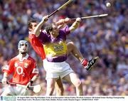 10 August 2003; Sean Og O'hAilpin of Cork, in action against Adrian Fenlon of Wexford during the Guinness All-Ireland Senior Hurling Championship Semi-Final match between Cork and Wexford at Croke Park in Dublin. Photo by Damien Eagers/Sportsfile