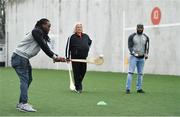 23 March 2018; Two-time Superbowl winning coach, Rob Ryan, Seattle Seahawks’ Earl Thomas, New York Giants’ Landon Collins and Baltimore Ravens’ Alex Collins, touched down in Dublin today for the NFL UK Live event, presented by Subway®. As part of their visit, Earl, Landon and Alex – accompanied by Rob Ryan and the Vince Lombardi trophy – put their athleticism to the test today at Dublin’s Clanna Gael Fontenoy GAA Club, where hurling legend Jackie Tyrell, and Dublin football legend attempted to teach them the skills of our national sports. The NFL UK Live event, presented by Subway®, will take place tomorrow (Saturday, 24th March) at Dublin’s Convention Centre – where Rob, Earl, Landon and Alex will also be joined by the Philadelphia Eagles’ Jay Ajayi for an evening of entertainment, hosted by Sky Sports presenter, Neil Reynolds. Doors for the event open at 6pm, with the live show kicking off at 7.30pm. Tickets for the event, which are free-of-charge, are available at: www.nfluk.com/events/Dublin.html . Pictured are Alex Collins of the Baltimore Ravens trying his hand at hurling at Clanna Gael Fontenoy GAA Club, Irishtown, Dublin   Photo by Brendan Moran/Sportsfile