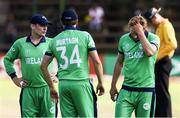 23 March 2018; Ireland captain William Porterfield, left, with his team-mates Tim Murtagh, centre, and Barry McCarthy of Ireland dejected following the ICC Cricket World Cup Qualifier match between Ireland and Afghanistan at Harare Sports Club in Harare, Zimbabwe. Photo by Jekesai Njikizana/Sportsfile