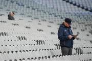 25 March 2018; A Dublin supporter reads his programme prior to the Allianz Hurling League Division 1 Quarter-Final match between Dublin and Tipperary at Croke Park in Dublin. Photo by Stephen McCarthy/Sportsfile