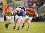 25 March 2018; Brian Glynn of Laois in action against Ciaran Moran of Carlow during the Allianz Football League Division 4 Round 7 match between Carlow and Laois at Netwatch Cullen Park in Carlow. Photo by Seb Daly/Sportsfile