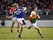 25 March 2018; Alan Farrell of Laois kicks a point under pressure from Darragh Foley of Carlow during the Allianz Football League Division 4 Round 7 match between Carlow and Laois at Netwatch Cullen Park in Carlow. Photo by Seb Daly/Sportsfile