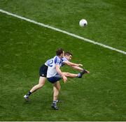25 March 2018; Fintan Kelly of Monaghan, under pressure from Emmet Ó Conghaile of Dublin, kicks what proved to be the winning point in the 74th minute of the Allianz Football League Division 1 Round 7 match between Dublin and Monaghan at Croke Park in Dublin. Photo by Ray McManus/Sportsfile