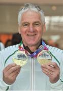 25 March 2018; Irish Masters team member Joe Gough of West Waterford AC, Co Waterford, with his gold medals which he won in the Men's over 65 800m and 1500m events, during European Masters Indoor Track & Field Championships in Madrid, at Dublin Airport in Dublin. Photo by Tomás Greally/Sportsfile