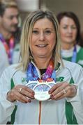 25 March 2018; Irish Masters team member Jackie Carthy from Kilmore AC, Co. Wexford, with her gold medal which she won in the over-45 5k Cross country, her silver medal which she won in the Women’s over-45 3000m event, and a further silver medal which Ireland won in the over-40 cross country during the European Masters Indoor Track & Field Championships in Madrid, at Dublin Airport in Dublin. Photo by Tomás Greally/Sportsfile