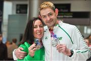 25 March 2018; Irish Masters team members Ashling Smith from Slí Cualann AC, Co. Wicklow, with her silver medal which she won in the Womens over 40 team cross country team event and her partner Ian Egan from Tuam AC, Co. Galway who won a silver medal, competing in the Men's over 45 cross country team event, during the European Masters Indoor Track & Field Championships in Madrid, at Dublin Airport in Dublin. Photo by Tomás Greally/Sportsfile