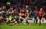 24 March 2018; Dave O'Callaghan of Munster is tackled by James Davies of Scarlets during the Guinness PRO14 Round 18 match between Munster and Scarlets at Thomond Park in Limerick. Photo by Diarmuid Greene/Sportsfile