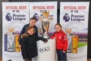 27 March 2018; Conor, Abbie and Ella Broadrick from Dalkey, Dublin, with the Premier League trophy during the Carling Ireland Premier League Retail Trophy Tour in Tesco Bloomfield Shopping Centre, Dun Laoghaire, Co Dublin. Photo by Eóin Noonan/Sportsfile