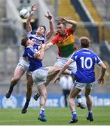 31 March 2018; Darragh Foley of Carlow in action against Trevor Collins, left, and John O'Loughlin of Laois during the Allianz Football League Division 4 Final match between Carlow and Laois at Croke Park in Dublin. Photo by David Fitzgerald/Sportsfile