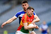 31 March 2018; Jordan Morrissey of Carlow in action against Colm Begley of Laois during the Allianz Football League Division 4 Final match between Carlow and Laois at Croke Park in Dublin. Photo by Piaras Ó Mídheach/Sportsfile