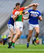 31 March 2018; Brendan Murphy of Carlow in action against Benny Carroll, left, and Robert Pigott of Laois during the Allianz Football League Division 4 Final match between Carlow and Laois at Croke Park in Dublin. Photo by Piaras Ó Mídheach/Sportsfile