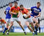 31 March 2018; Daniel St Ledger of Carlow in action against Alan Farrell of Laois during the Allianz Football League Division 4 Final match between Carlow and Laois at Croke Park in Dublin. Photo by David Fitzgerald/Sportsfile