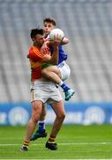 31 March 2018; Eoghan Ruth of Carlow in action against Trevor Collins of Laois during the Allianz Football League Division 4 Final match between Carlow and Laois at Croke Park in Dublin. Photo by Piaras Ó Mídheach/Sportsfile