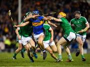 31 March 2018; Jason Forde of Tipperary is tackled by Sean Finn, left, and Richie English of Limerick during the Allianz Hurling League Division 1 semi-final match between Tipperary and Limerick at Semple Stadium in Thurles, Co Tipperary. Photo by Eóin Noonan/Sportsfile