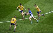 1 April 2018; Dara McVeety of Cavan in action against Roscommon players, left to right, Peter Domican, Conor Daly, and Ultan Harney during the Allianz Football League Division 2 Final match between Cavan and Roscommon at Croke Park in Dublin. Photo by Daire Brennan/Sportsfile