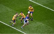 1 April 2018; Dara McVeety of Cavan in action against Roscommon players, left to right, Cathal Compton, Niall Kilroy, and Fergal Lennon during the Allianz Football League Division 2 Final match between Cavan and Roscommon at Croke Park in Dublin. Photo by Daire Brennan/Sportsfile