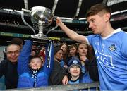 1 April 2018; Daniel McAuley, from Clonsilla, Dublin, lifts the cup with the help of Michael Fitzsimons of Dublin following the Allianz Football League Division 1 Final match between Dublin and Galway at Croke Park in Dublin. Photo by Stephen McCarthy/Sportsfile