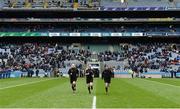 1 April 2018; Referee Anthony Nolan, centre, and his linesmen Conor Lane and James Bermingham, right, warm-up before the Allianz Football League Division 1 Final match between Dublin and Galway at Croke Park in Dublin. Photo by Piaras Ó Mídheach/Sportsfile