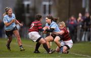 4 April 2018; Roisin Crowe of UCD is tackled by Anna Harkin, right, and Claudia Alonso of DUFC during the Annual Women’s Rugby Colours Match 2018 match between Dublin University FC and UCD at College Park in Trinity College, Dublin. Photo by David Fitzgerald/Sportsfile