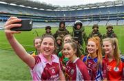 11 April 2018; The Lidl All Ireland Post Primary Schools Finals were launched today at Croke Park. The finals will be contested at Senior and Junior levels, with three finals in each grade. It’s an all-Loreto decider in the Senior A final, with Loreto (Clonmel, Tipperary) meeting Loreto (Cavan). Meanwhile, Glenamaddy (Galway) will play Presentation, Thurles (Tipperary) in the senior B final and in the senior C decider, Coláiste Bhaile Chláir, Claregalway (Galway) will take on Scoil Mhuire, Trim (Meath). Loreto (Cavan) are also in the junior A decider, where their opponents are ISK, Killorglin (Kerry). In the junior B final, Coláiste Bhaile Chláir, Claregalway (Galway) are also involved, and their opponents are St Brigid’s S.S., Killarney, Kerry. Finally, the junior C final is the meeting of St Marys H.S., Midleton (Cork) and St Clare's Comprehensive, Manorhamilton (Leitrim). Full fixture details available at www.ladiesgaelic.ie. Pictured is Elaine Brady, Loreto, Cavan, junior captain, taking a selfie with other captains and members of the Engineer Specialist Search and Clearance Team, Corps of Engineers, Irish Defence Forces. Croke Park, Dublin. Photo by Piaras Ó Mídheach/Sportsfile