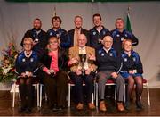 14 April 2018; Nuala Kelly, Bernadette Kelly, Katie Dwyer, Christy Kelly, David Kelly, Stephen Madigan, Timmie Lynch and T.J. Madigan from Feenagh/Kilmeedy, Limerick, are presented with the trophy by Uachtarán Chumann Lúthchleas Gael John Horan, front row, cenrte, and Antóin Mac Gabhann, Cathaoirleach, Coiste Náisúnta Scór, back row, centre, after winning the Léiriú Stáitse category during the All-Ireland Scór Sinsir Finals 2018 at the Clayton Hotel Ballroom & Knocknarea Arena in Sligo IT, Sligo. Photo by Eóin Noonan/Sportsfile