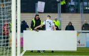 16 April 2018; Darragh Leahy of Bohemians hands a mobile sign to a Derry City steward after it blew onto the playing field during the SSE Airtricity League Premier Division match between Derry City and Bohemians at the Brandywell Stadium in Derry. Photo by Oliver McVeigh/Sportsfile