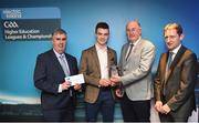 16 April 2018; UL hurler David McCarthy from Limerick is presented with his award by Uachtarán Chumann Lúthchleas Gael John Horan, in the company of  Jim Dollard, Executive Director Electric Ireland, right, and Gerry Tully, Chairman of Comhairle Ardoideachais CLG, left, at the Electric Ireland HE GAA Football & Hurling Rising Stars Awards for 2018, in Croke Park. The awards acknowledge outstanding performances in the battle for third level football and hurling Championships and come at the end of what was an epic season of GAA action. Photo by Stephen McCarthy/Sportsfile